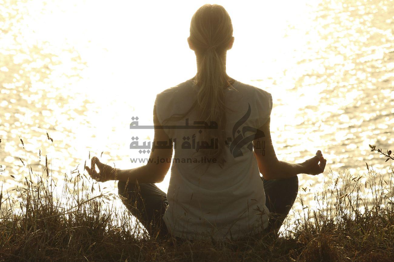 Free woman doing yoga pose